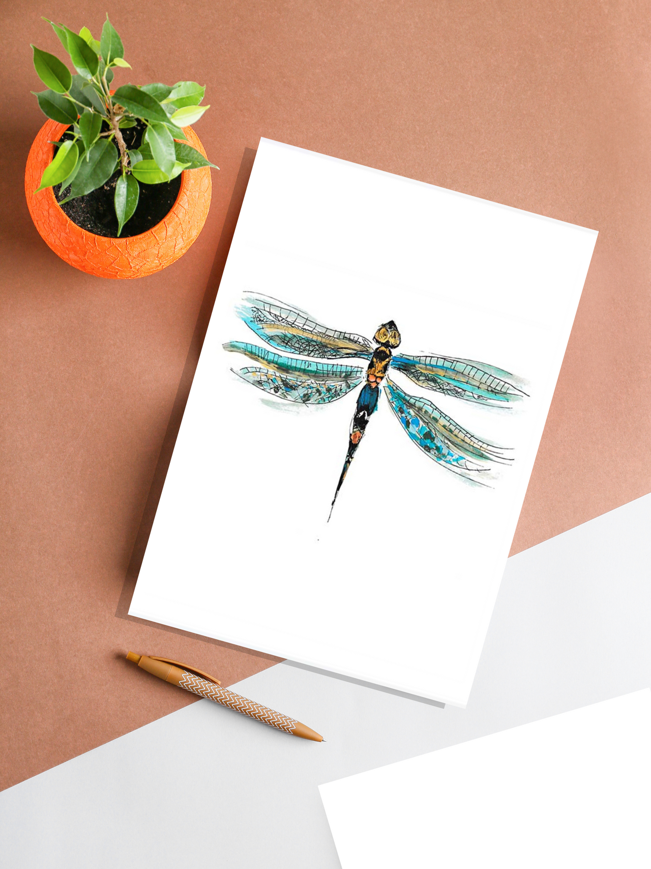 dragonfly art print on table