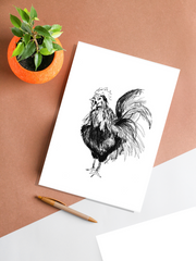 rooster art print hanging on table