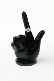 All black ring holder in the guns up hand signal